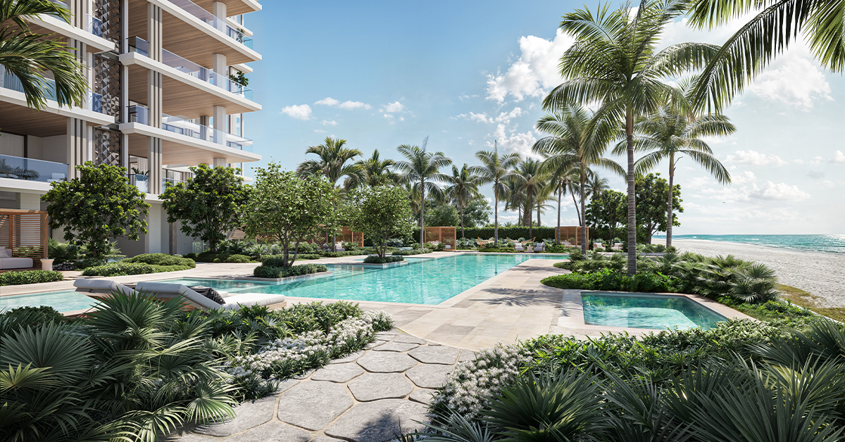 Beachfront residential pool with palm trees, landscaped gardens, lounge chairs, and modern condominium balconies beside the ocean.