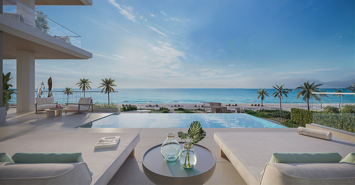 Luxury beachfront terrace with infinity pool overlooking the ocean and palm-lined shore