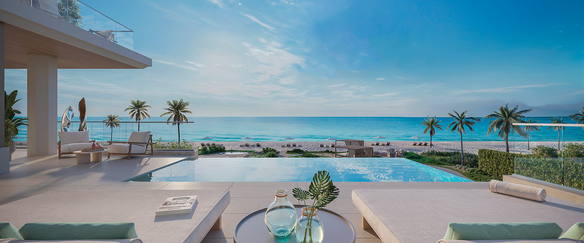 Luxury beachfront terrace with infinity pool overlooking ocean and palm trees