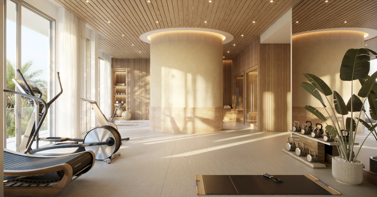 Private gym with cardio equipment, weights, and warm wood interior design