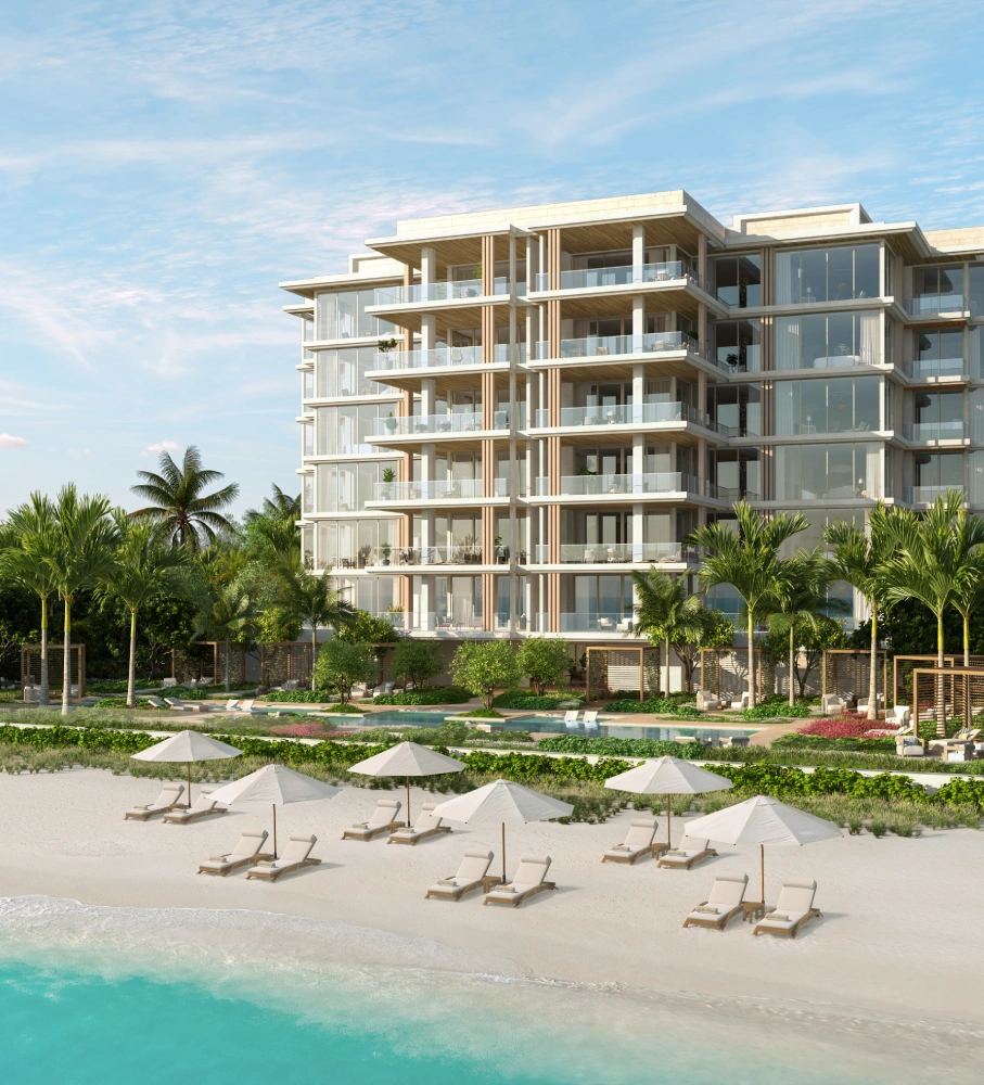 Beachfront view of Olana Naples with expansive glass architecture along the Naples beachfront.